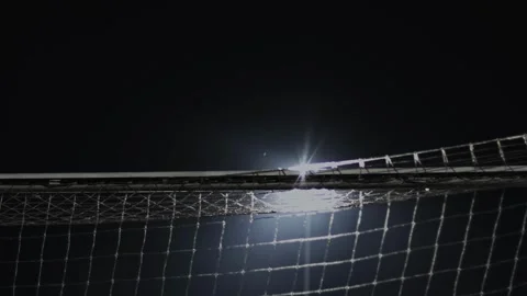 Goal crossbar with net back side during soccer match at night. English football Видео 243736930