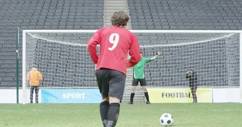 Goal keeper makes a save in goal kick during soccer match Stock Footage