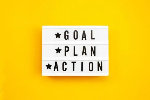 Goal, Plan, Action text on light box on yellow background. Stock-Fotos