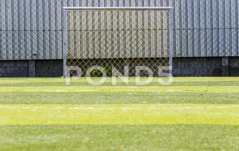 Goal soccer green field background Stock Photos