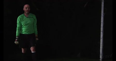 Goalie leaps sideways to block kick. Stock Footage 69214824