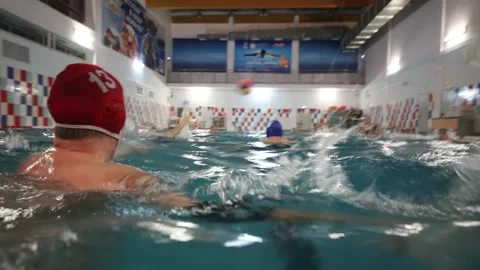 Goalkeeper beating back ball on water polo in Stock Footage 299665803