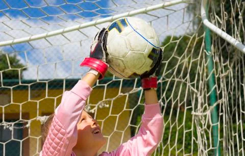 Goalkeeper child blocking the ball Stock Photos