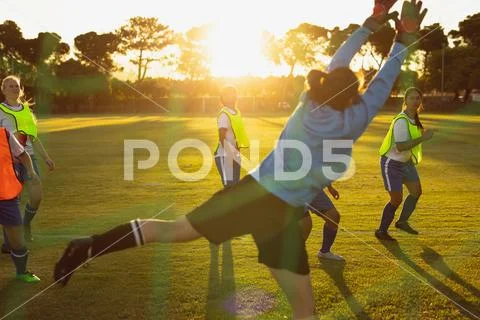 Goalkeeper defending football Stock Photos