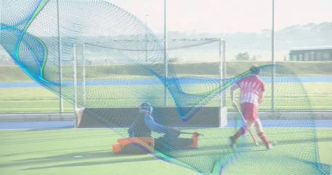 Goalkeeper lunging at attacker dribbling deflecting shot blocking goal in Stock Footage 318011111