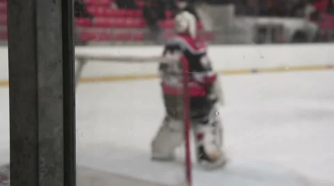 Goalkeeper ready to face rival attack during ice hockey match, defending the net Video stock 63103520