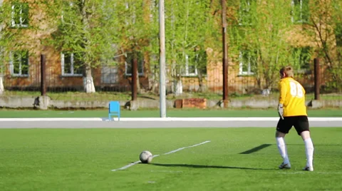 Goalkeeper sets the ball and kicks them out Stock Footage 37851657