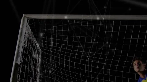 Goalkeeper tracking incoming ball, timing leap, deflecting shot, protecting Stock Footage 320916089
