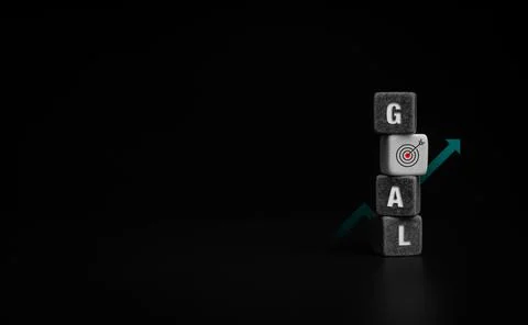 Goals concept with cube blocks on dark background. Foto stock
