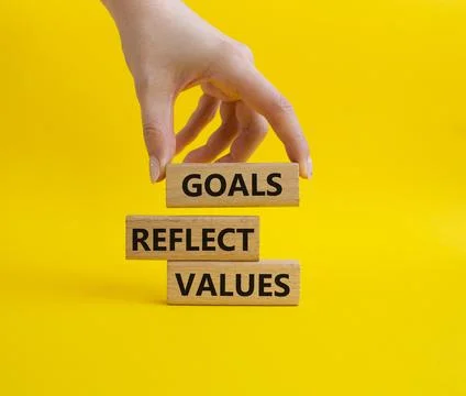 Goals reflect values symbol. Concept words Goals reflect values on wooden b.. Stock Photos