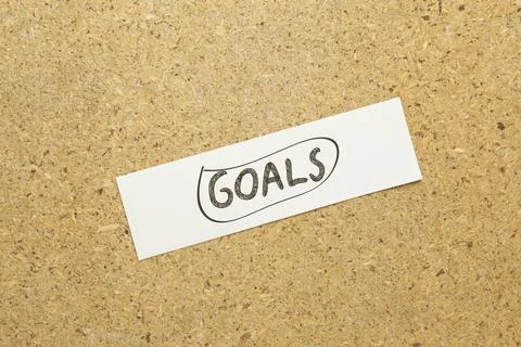 Goals text on brown background Stock Photos