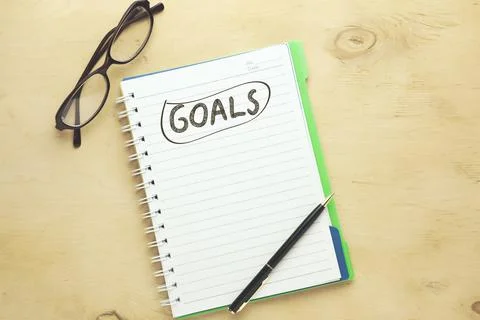 Goals text on brown background Stock Photos