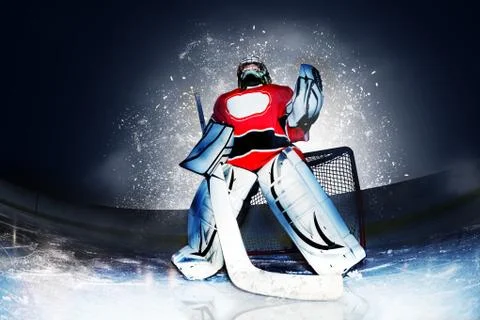 Goaltender at hockey arena in searchlight rays Stock Photos