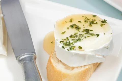 Goat cheese appetizer with honey Stock Photos