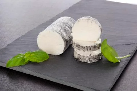 Goat cheese with basil Stock Photos