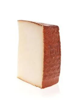 Goat cheese slice isolated on white background. Stock Photos