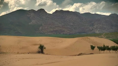 Gobi Desert sand dunes with rugged mountains, Mongolia landscape under sky Stock Footage 339468123