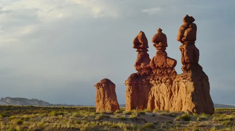Goblin Valley Utah Clouds in Hoodoo Rocks Three Towers at Sunset Stock Footage 53279663