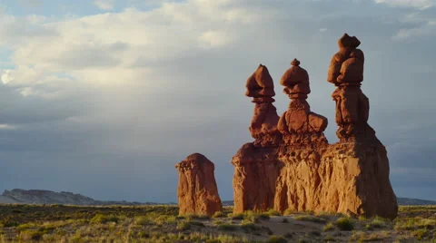 Goblin Valley Utah Clouds in Time Lapse Hoodoo Rocks Three Towers Reframed Stock Footage 53279720