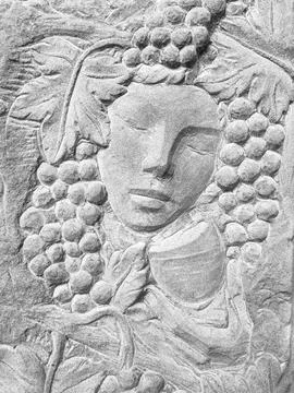 God Bacchus bas relief Stock Photos