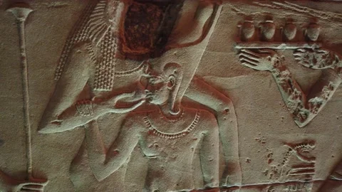 The god Isis while feeding from his mother Stock Footage 142976500