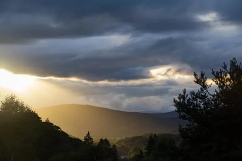 God Rays of light during the sunset outside of Perth, Scotland. Stock Photos