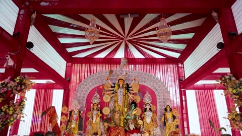Goddess Durga Statue at Durga Puja Pandal Interior With Floral Decorations and Stock Footage 345252643