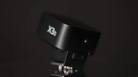 Godox X3 TTL Wireless Flash Trigger on Black Background 스톡 동영상 346204238
