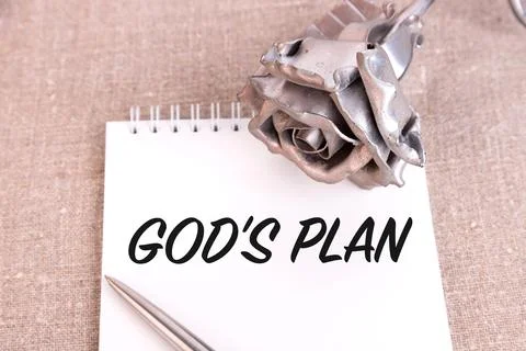 God's Plan, the text is written in a notebook lying on a linen linen and an i Stock Photos