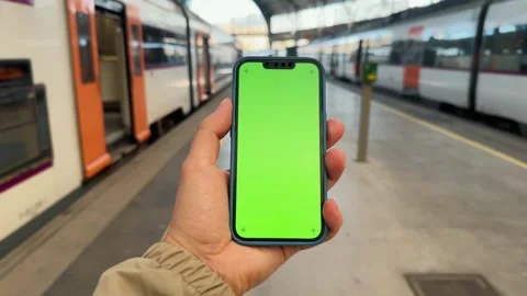 Goes to the train, looking for a train carriage by using mobile application. Stock Footage 294336089