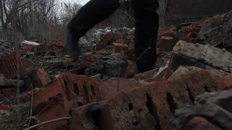 Goes by wreckage of the brick,left to right Vídeo Stock 35965196