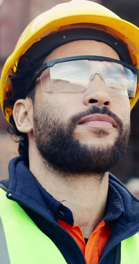 Goggles, hard hat and thinking with man on construction site for engineering or Stock Footage 336776762
