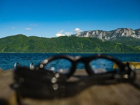 Goggles for swimming lie on the table Stock Photos