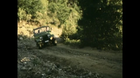 Going up a dirt track in a jeep Stock Footage 252097472