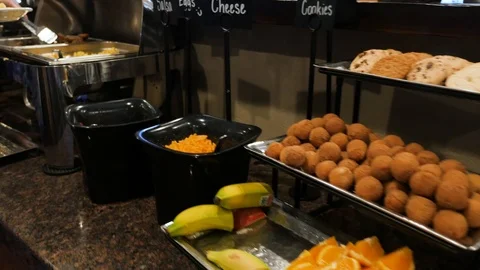 Going down breakfast buffet line focusing on food Video stock 94236265
