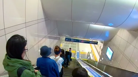 Going down the building using the escalator in Osaka Japan Stock Footage 129279211