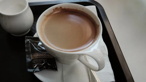 Going Down on a Coffee and a Glass of Water at an outside Cafe Vídeo Stock 257879441