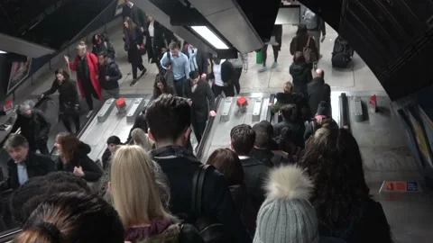 Going Down Escalator in Busy Tube Station in London Stock Footage 154148669
