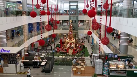Going Down an Escalator Inside a Mall with Christmas Decorations Stock Footage 228707702