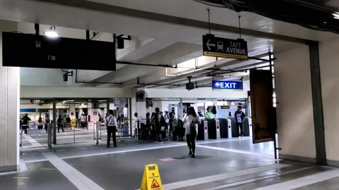 Going Down an Escalator in Metro Rail Transit Cubao Station Philippines Stock Footage 234371324