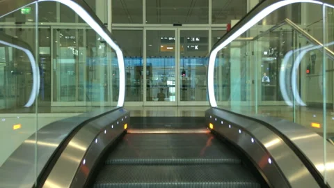 Going down an escalator at Munich Airport Stock Footage 186757942