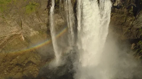 Going Down a Mountain Waterfall, Drone Stock Footage 99295571