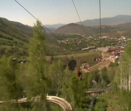 Going down a mountain zipline Stock Footage 21671529