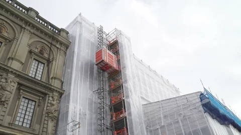 A going down outdoor elevator on a construction site Stock Footage 98175100