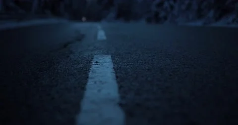 Going down scary winter street in the early mornings of a german forest Stock Footage 232676658