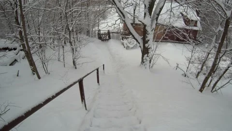 Going down the snow stairs Stock Footage 167411053