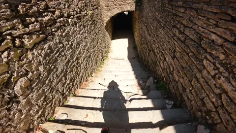 Going down the stairs inside the Ottoman castle fortress of Gjirokaster or .. Stock Footage 249181185