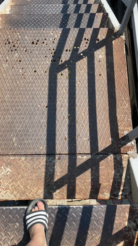 Going down the stairs to an iron bridge but very damaged Stock Footage 204120707