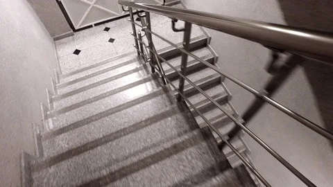 Going down the stairs so fast. It is a stairs in a fire exit in a building Video stock 70220837