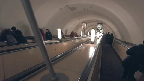 Going down the stairs in the subway on the escalator to the subway station Stock Footage 175967392
